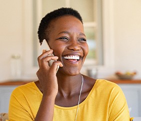 Woman smiling while talking on phone