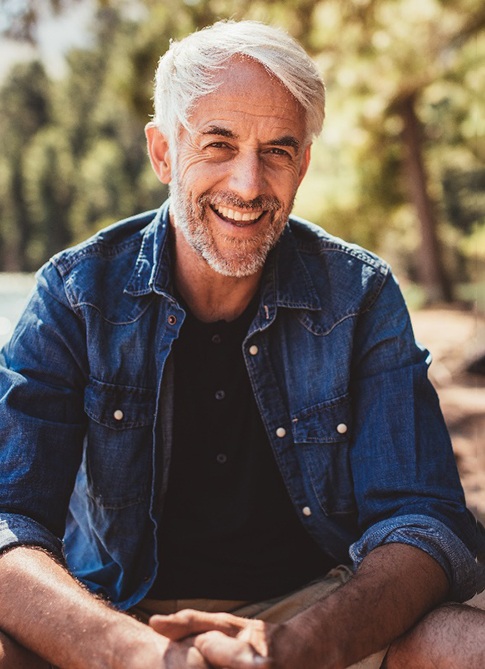 a man smiling with dental bridges in Mankato