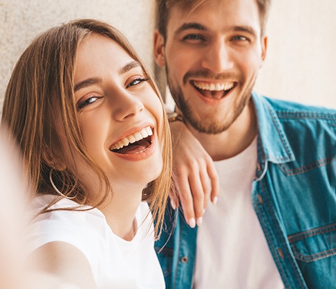 two people smiling with dental bridges in Mankato