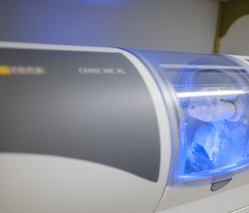 CEREC machine milling a crown