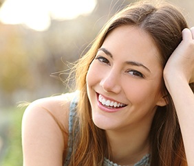 woman smiling after getting cosmetic dentistry in Mankato