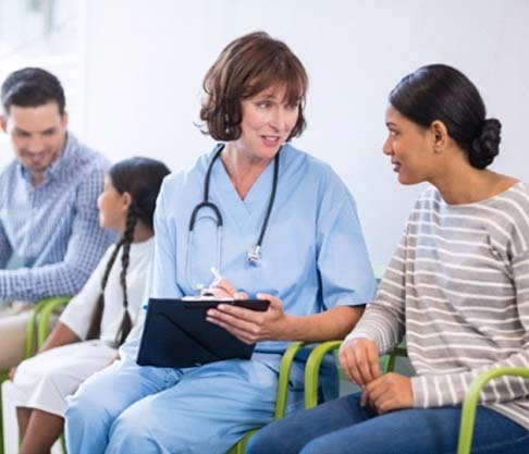 dentist discussing the cost of emergency dentistry in Mankato with a patient