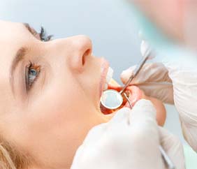 young woman getting dental checkup in Mankato