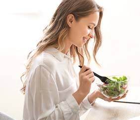 young woman eating healthy food