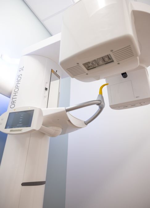 Woman receiving BioJVA analysis to diagnose jaw joint dysfunction