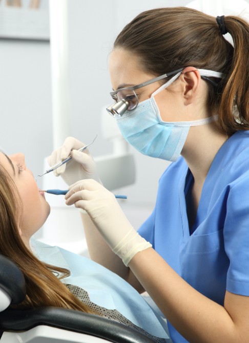 Doctor Hempen treating dental patient