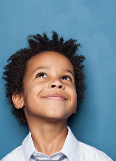 Smiling child looking upward