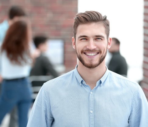 Man with healthy smile after periodontal therapy