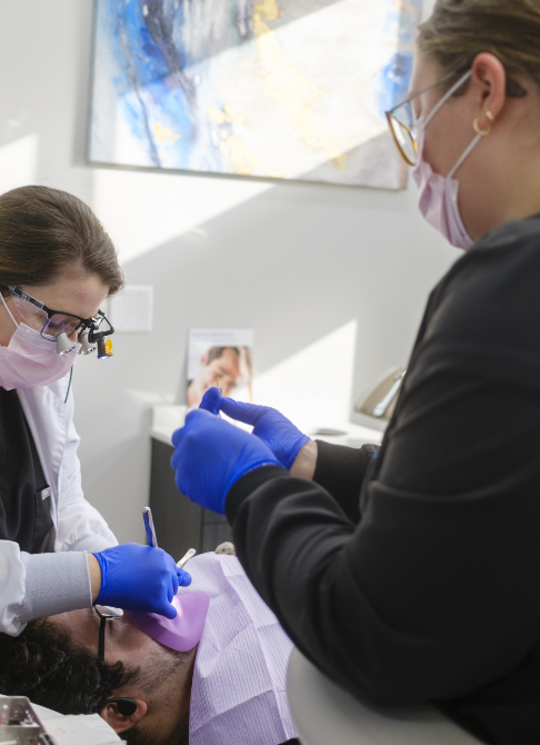 Young man with healthy smile after restorative dentistry