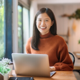 Woman booking a dental appointment online