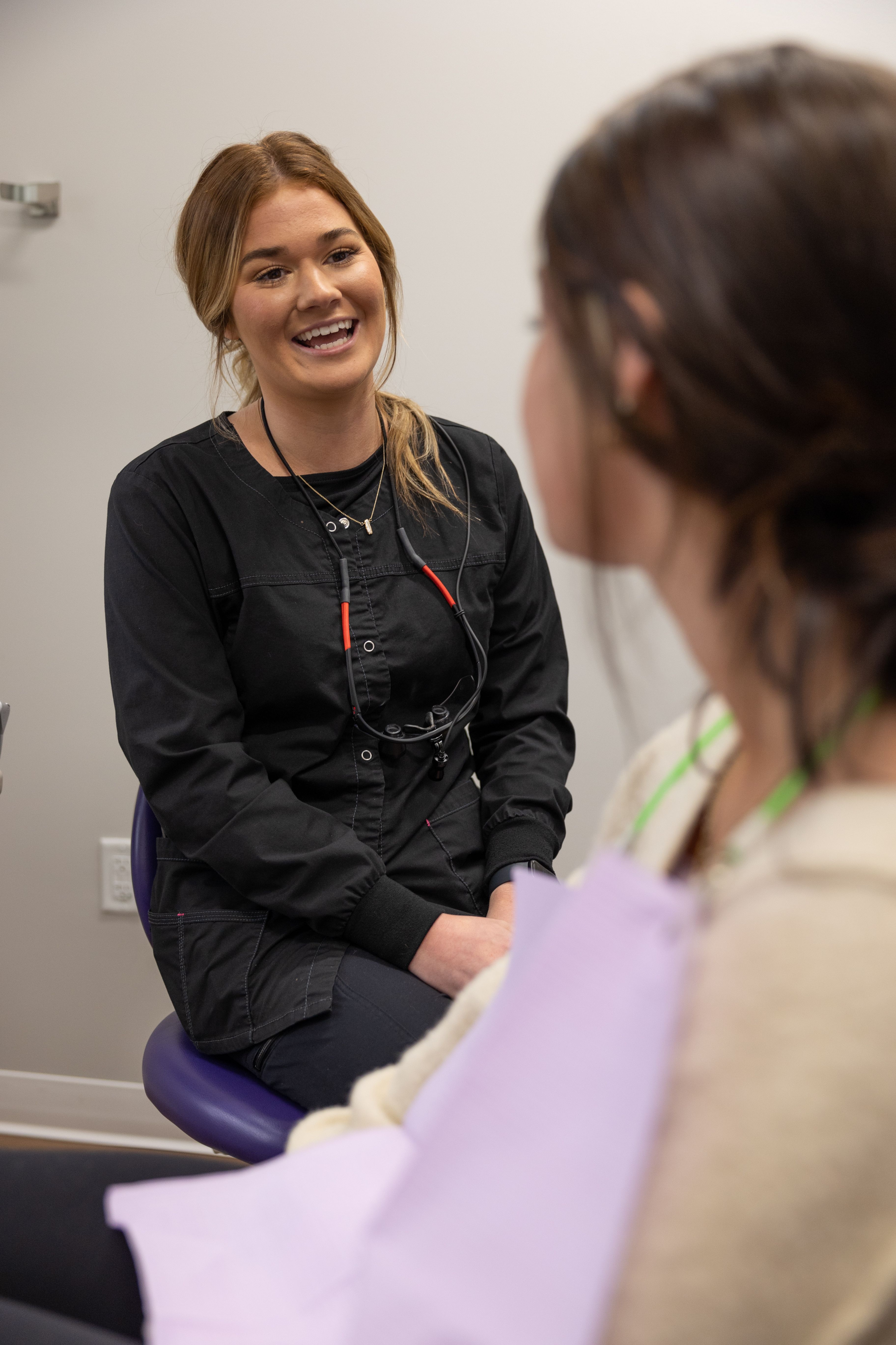 Mother and child smiling after receiving dental services in Mankato Minnesota