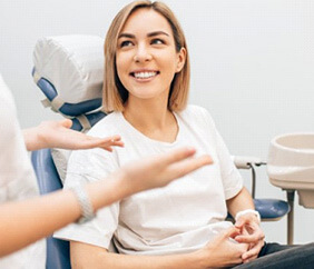 Lady smiles at dentist