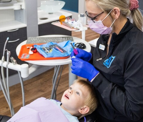 Mother and baby smiling after frenectomy in Mankato