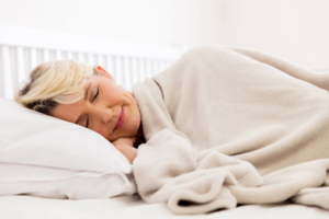 Woman sleeping soundly in her bed
